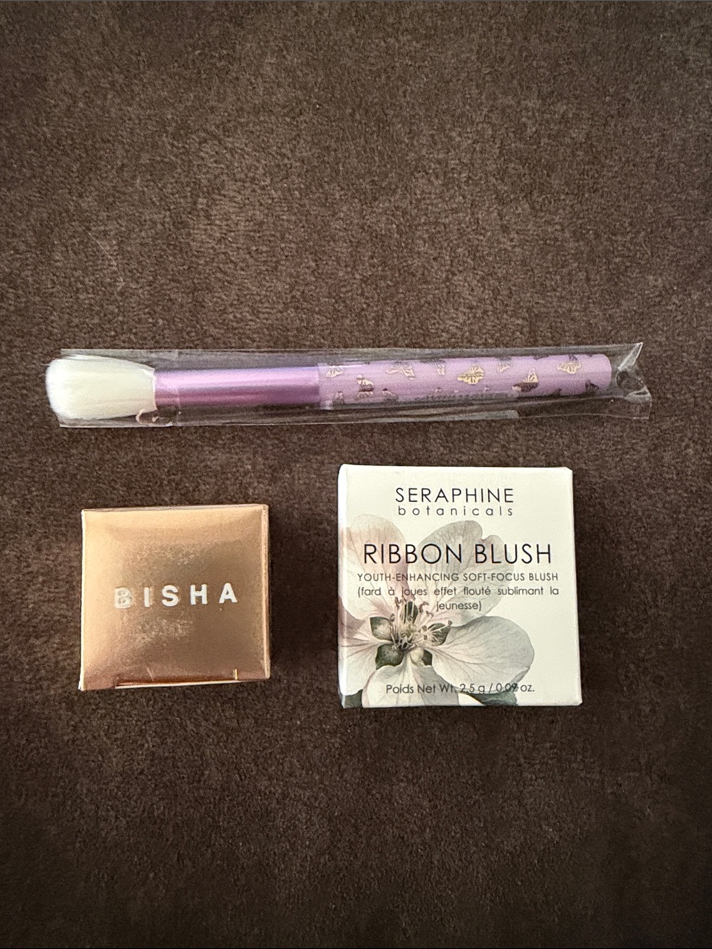 IN WRAPPING: Setting powder, blush, and brush